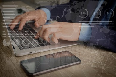 Technology and business. Man working on laptop at table and graphs with schemes, double exposure