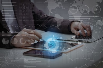 Image of Technology and business. Man working on devices at table and graphs with schemes, double exposure