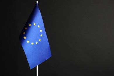 One flag of European Union on black background. Space for text