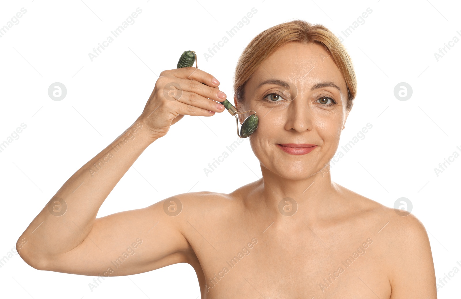 Photo of Beautiful woman doing facial self massage with roller on white background