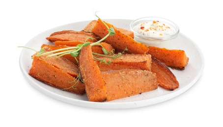 Pieces of tasty baked sweet potato with sauce and microgreens isolated on white