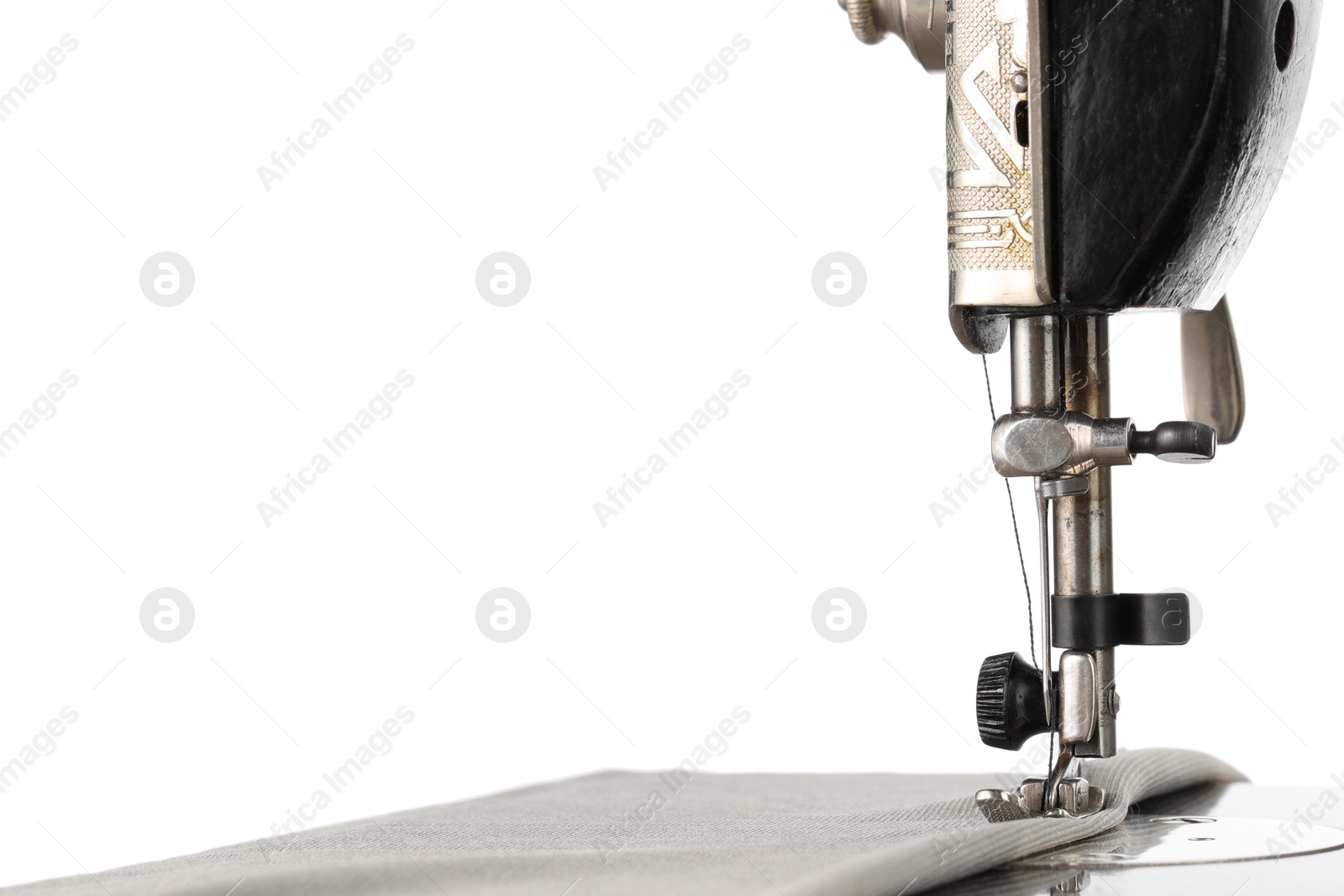 Photo of Sewing machine with grey fabric isolated on white