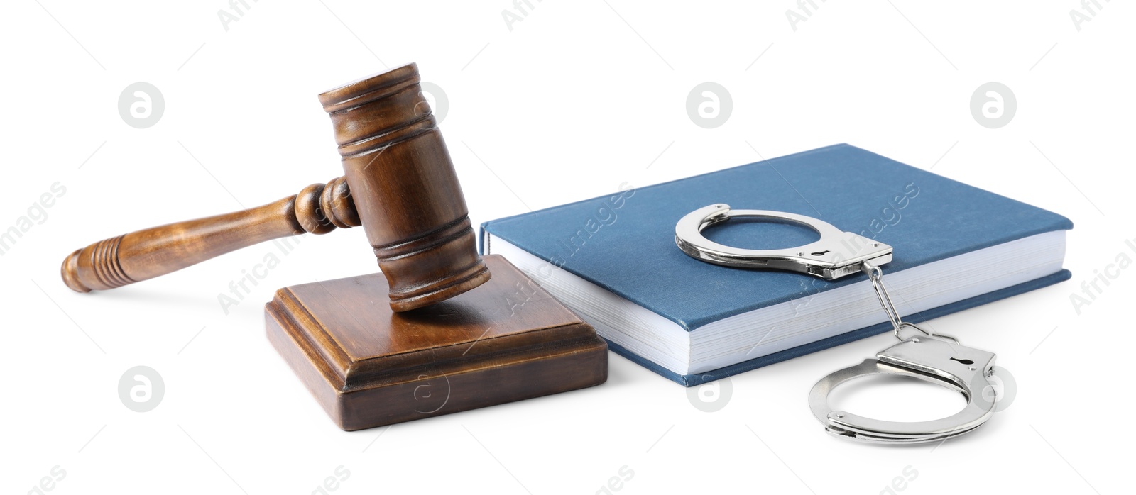 Photo of Handcuffs, judge's gavel and book isolated on white