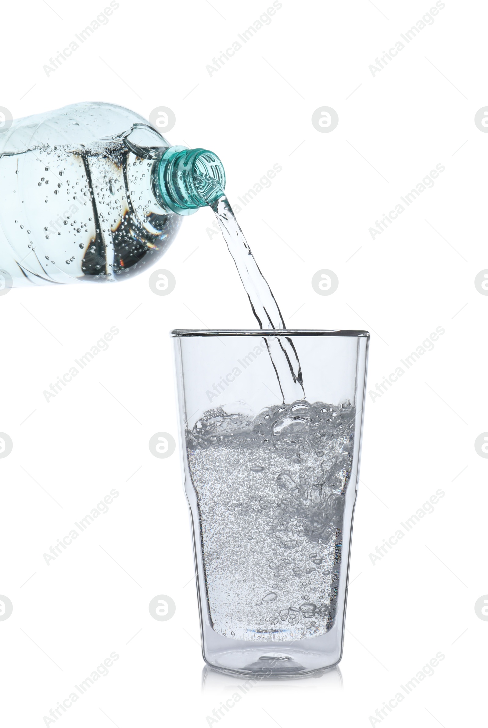 Photo of Pouring soda water from bottle into glass on white background