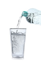 Photo of Pouring soda water from bottle into glass on white background