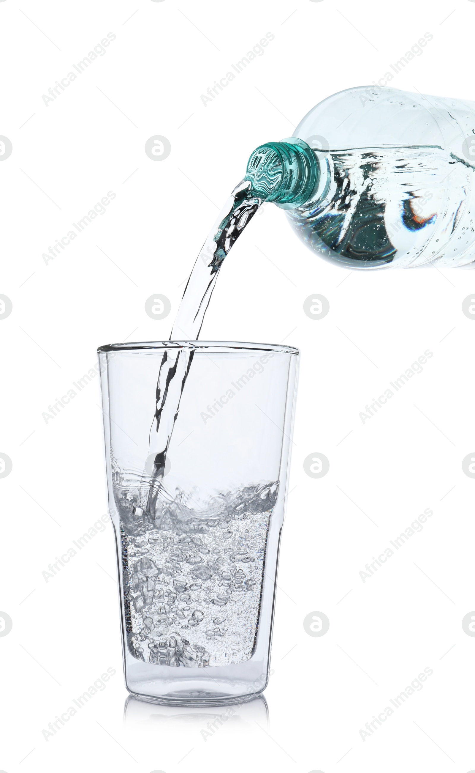 Photo of Pouring soda water from bottle into glass on white background