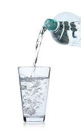 Photo of Pouring soda water from bottle into glass on white background