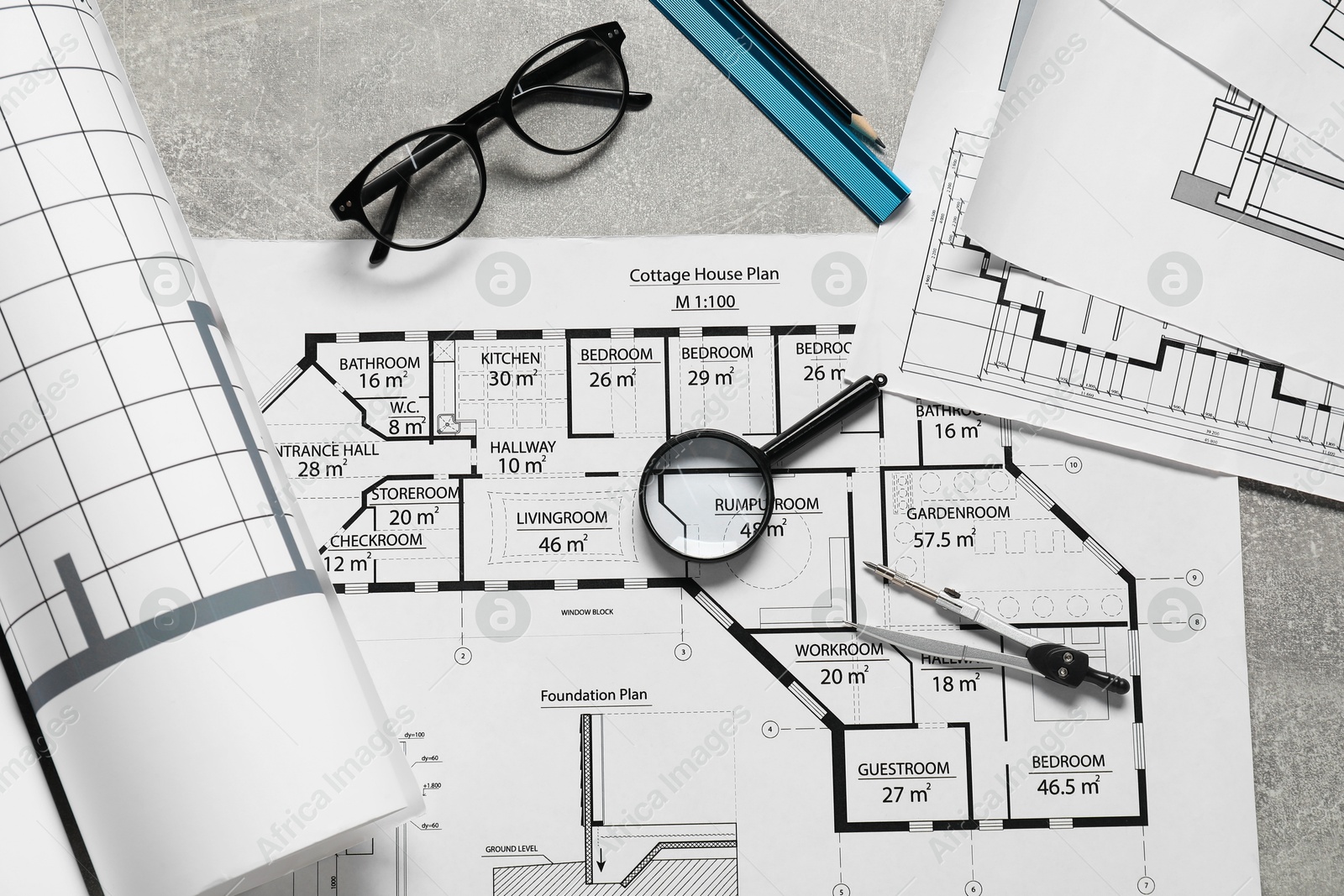 Photo of Different engineering drawings and tools on grey textured table, flat lay