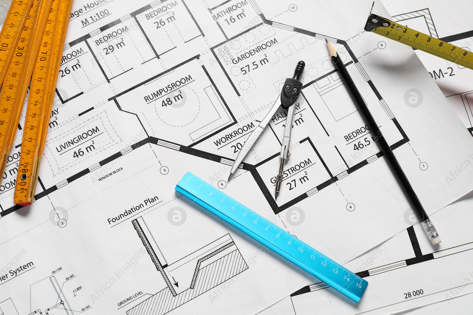 Photo of Different engineering drawings and tools on table, flat lay