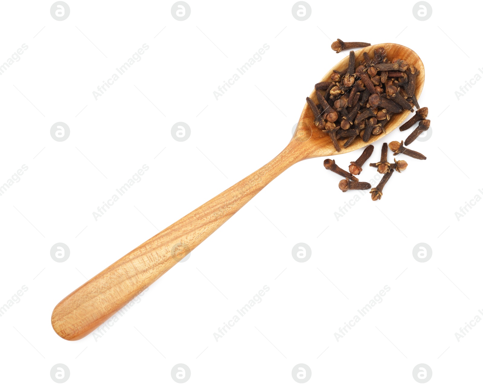 Photo of Dry clove buds in wooden spoon on white background, top view. Aromatic spice