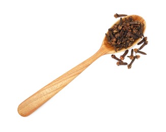 Photo of Dry clove buds in wooden spoon on white background, top view. Aromatic spice