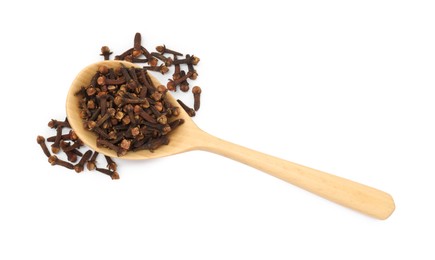 Photo of Dry clove buds in wooden spoon on white background, top view. Aromatic spice