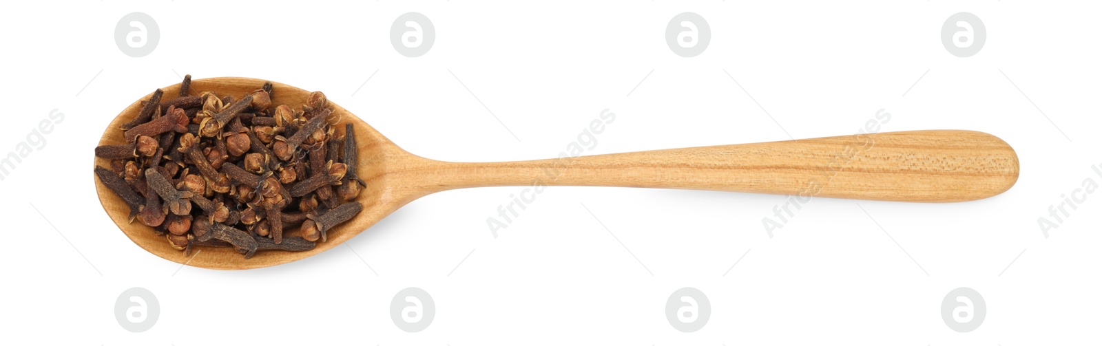 Photo of Dry clove buds in wooden spoon on white background, top view. Aromatic spice