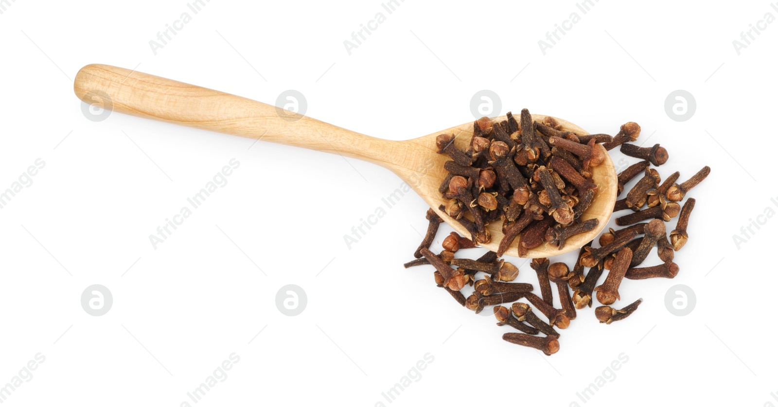 Photo of Dry clove buds in wooden spoon on white background, top view. Aromatic spice