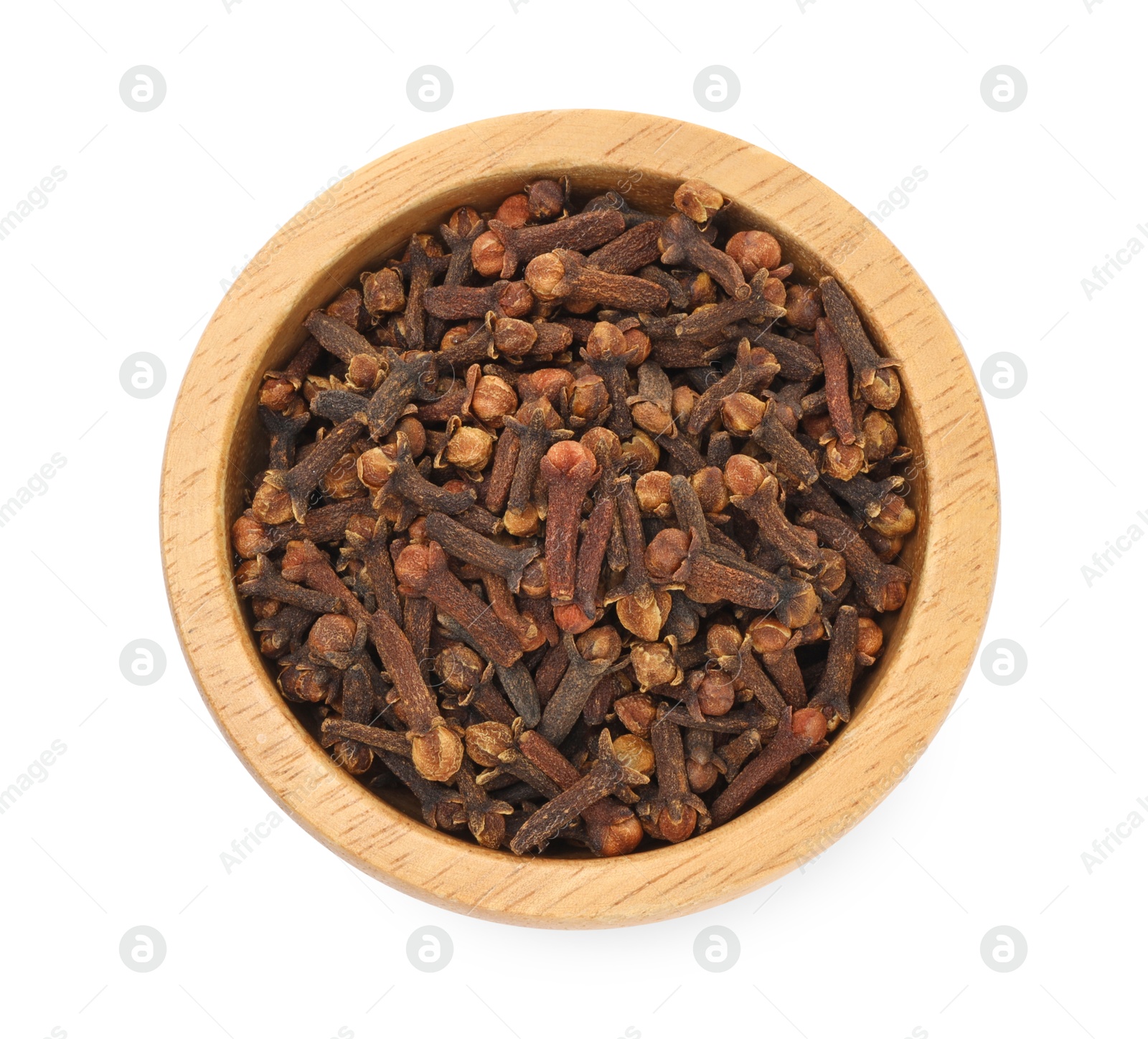 Photo of Dry clove buds in wooden bowl on white background, top view. Aromatic spice