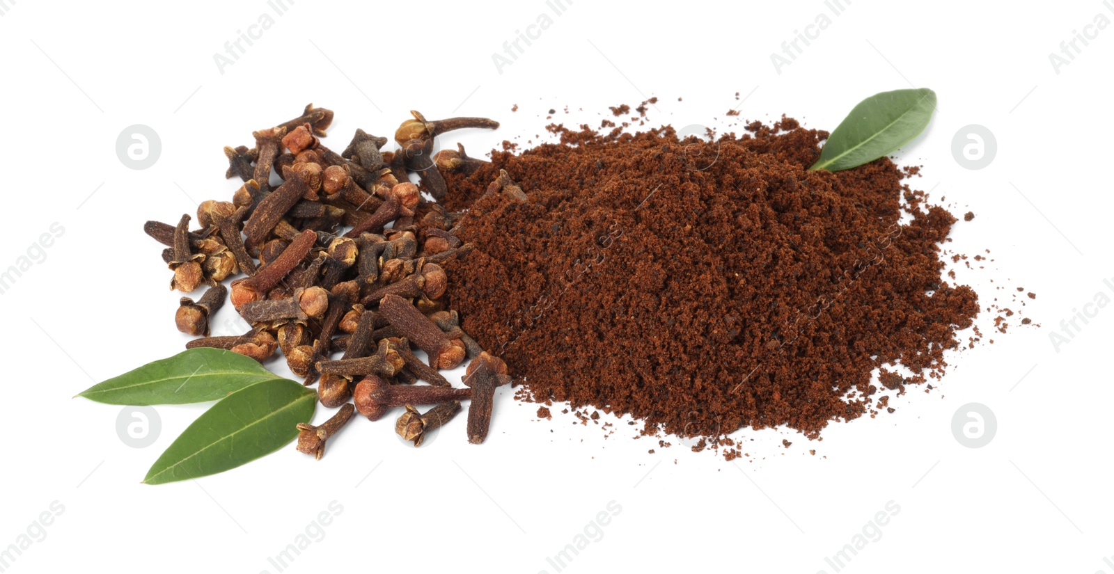 Photo of Pile of clove powder, dried buds and green leaves on white background. Aromatic spice