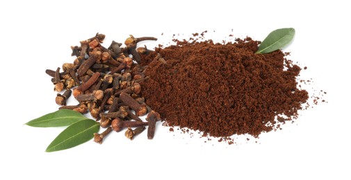 Photo of Pile of clove powder, dried buds and green leaves on white background. Aromatic spice