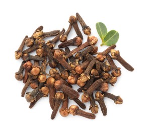 Photo of Dry clove buds and green leaves on white background, top view. Aromatic spice