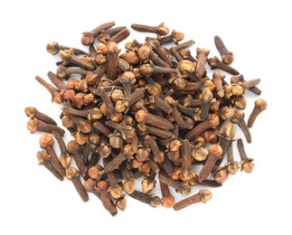 Pile of dry clove buds on white background, top view. Aromatic spice