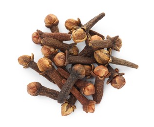 Photo of Pile of dry clove buds on white background, top view. Aromatic spice