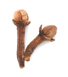 Photo of Dry clove buds on white background, top view. Aromatic spice