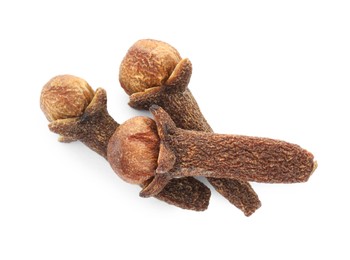 Dry clove buds on white background, top view. Aromatic spice