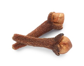 Photo of Dry clove buds on white background, top view. Aromatic spice