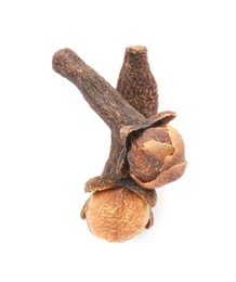 Dry clove buds on white background, top view. Aromatic spice