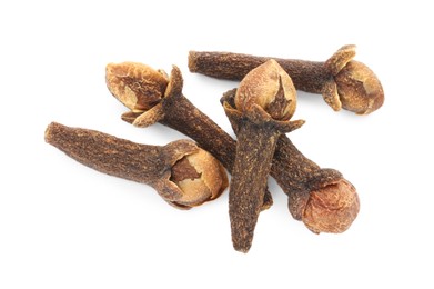 Dry clove buds on white background, top view. Aromatic spice