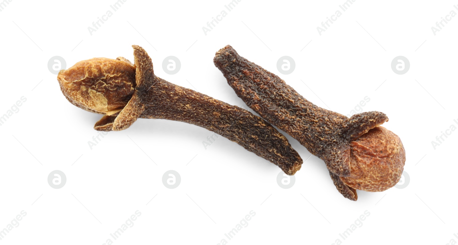 Photo of Dry clove buds on white background, top view. Aromatic spice