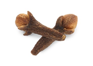 Photo of Dry clove buds on white background, top view. Aromatic spice