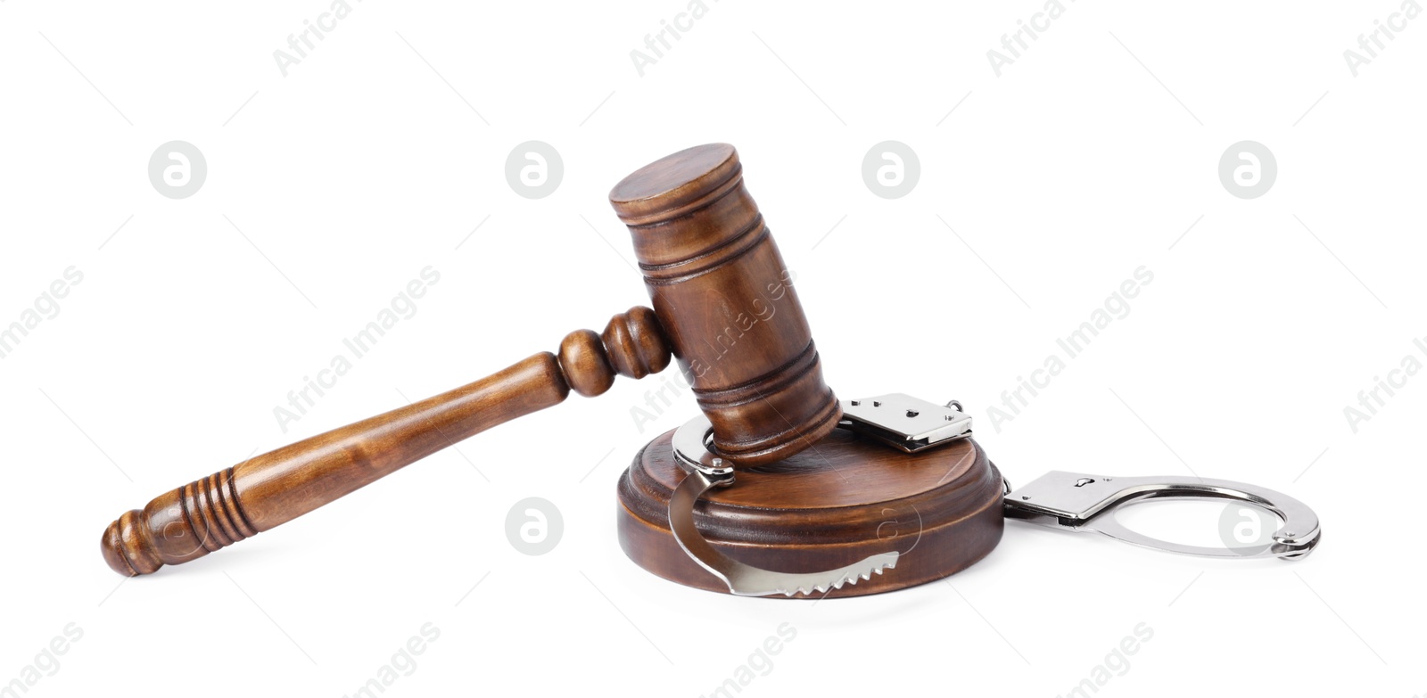 Photo of Handcuffs and judge's gavel isolated on white