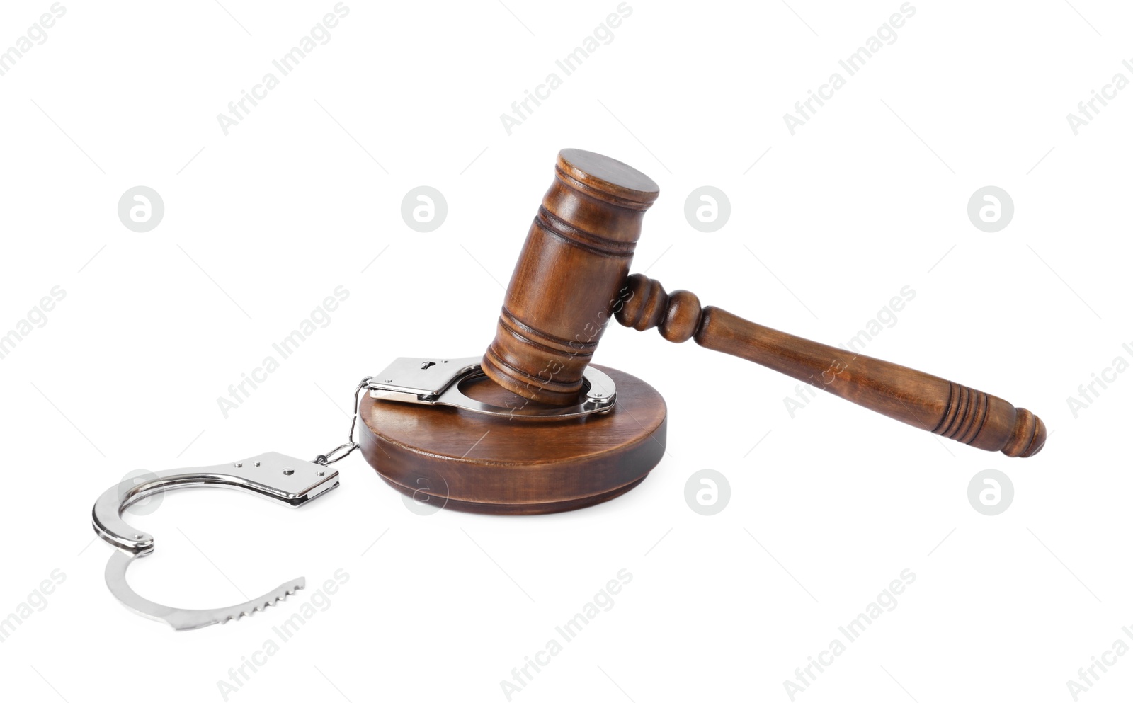 Photo of Handcuffs and judge's gavel isolated on white