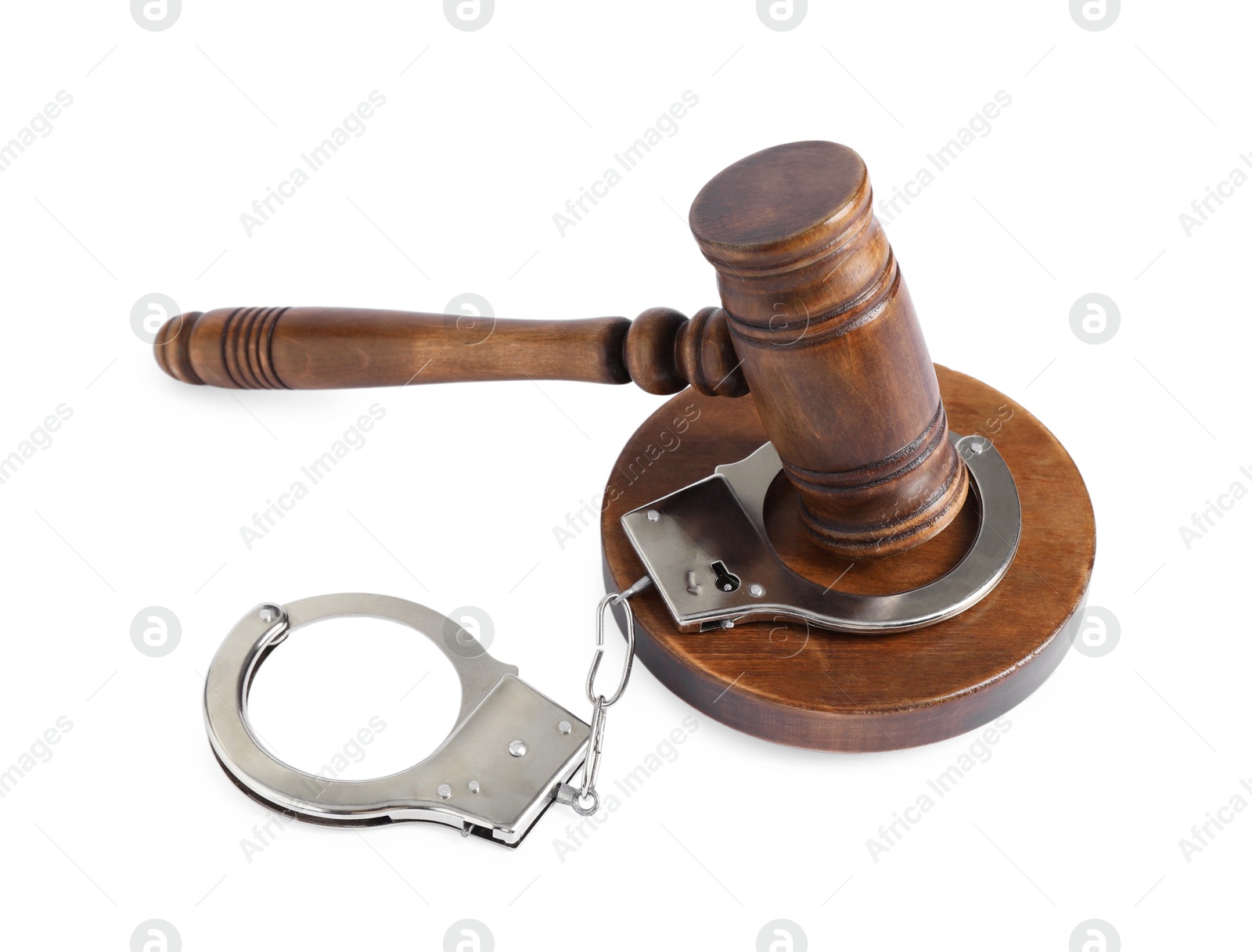 Photo of Handcuffs and judge's gavel isolated on white