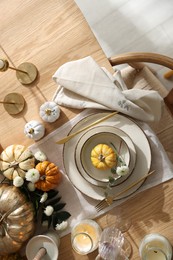 Photo of Stylish table setting with beautiful dishware and autumn decor in dining room, top view