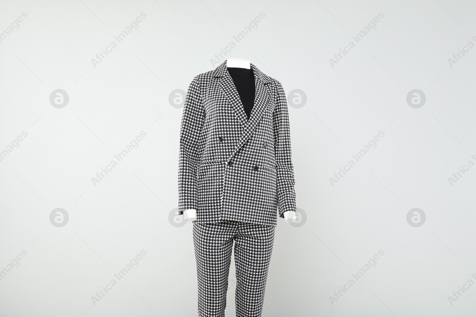 Photo of Female mannequin with stylish outfit on light background