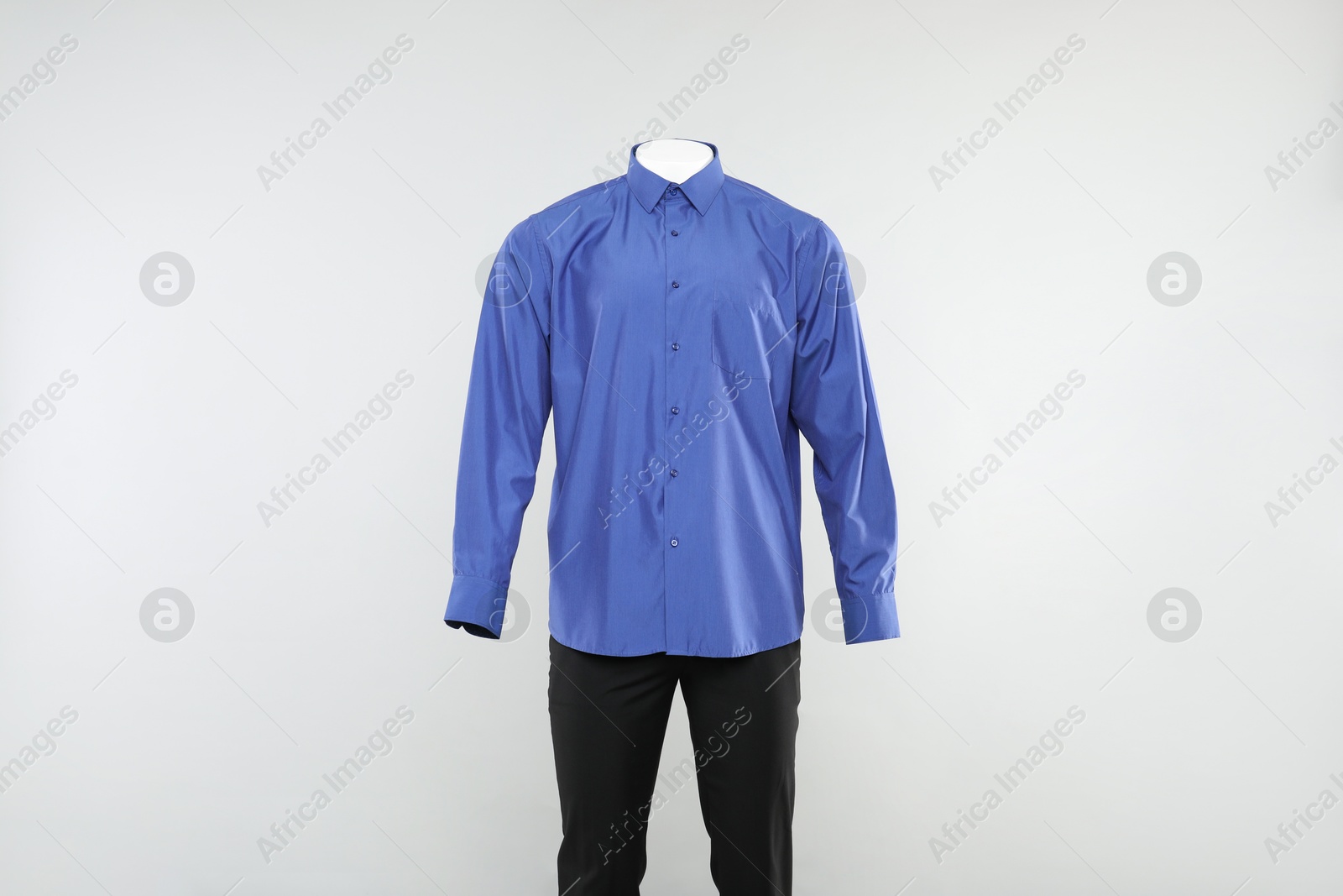 Photo of Male mannequin with stylish outfit on light background