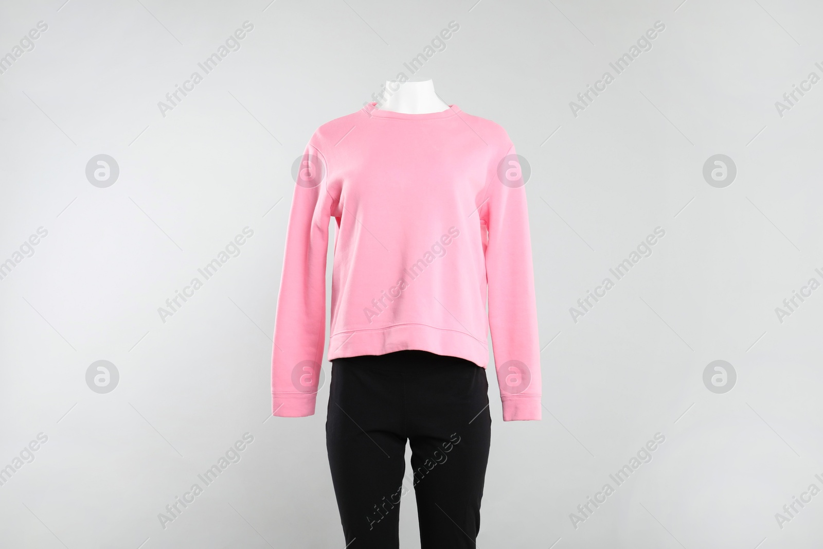 Photo of Female mannequin with stylish outfit on light background