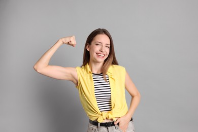 Photo of Portrait of happy winner on gray background