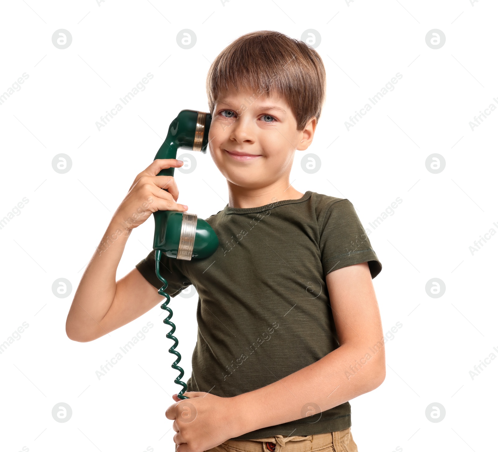 Photo of Cute little boy with handset of telephone on white background