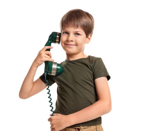 Photo of Cute little boy with handset of telephone on white background