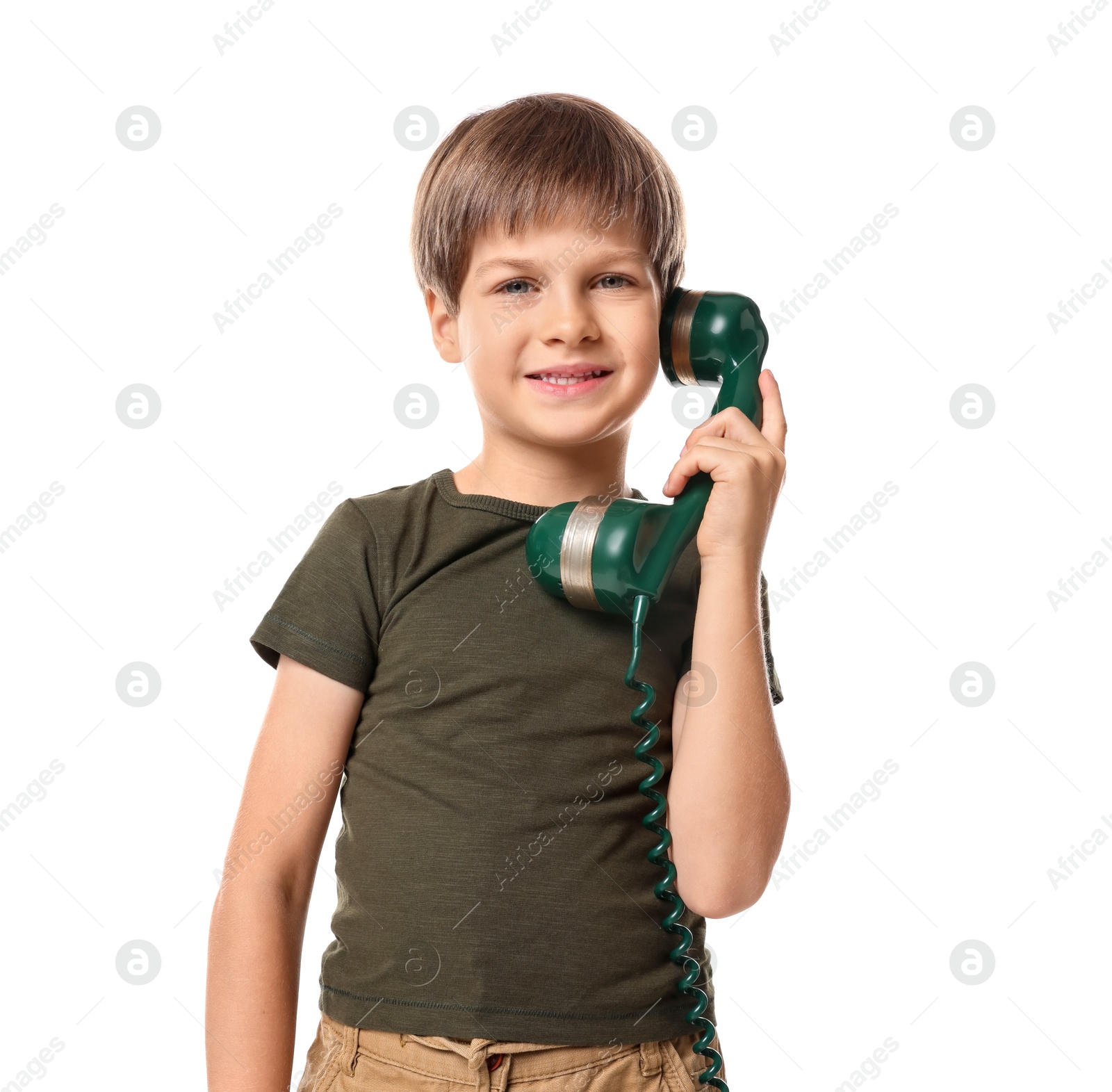 Photo of Cute little boy with handset of telephone on white background