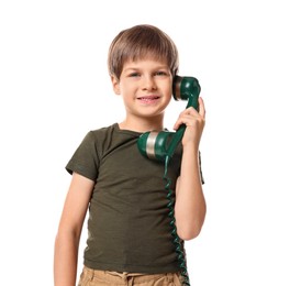 Photo of Cute little boy with handset of telephone on white background