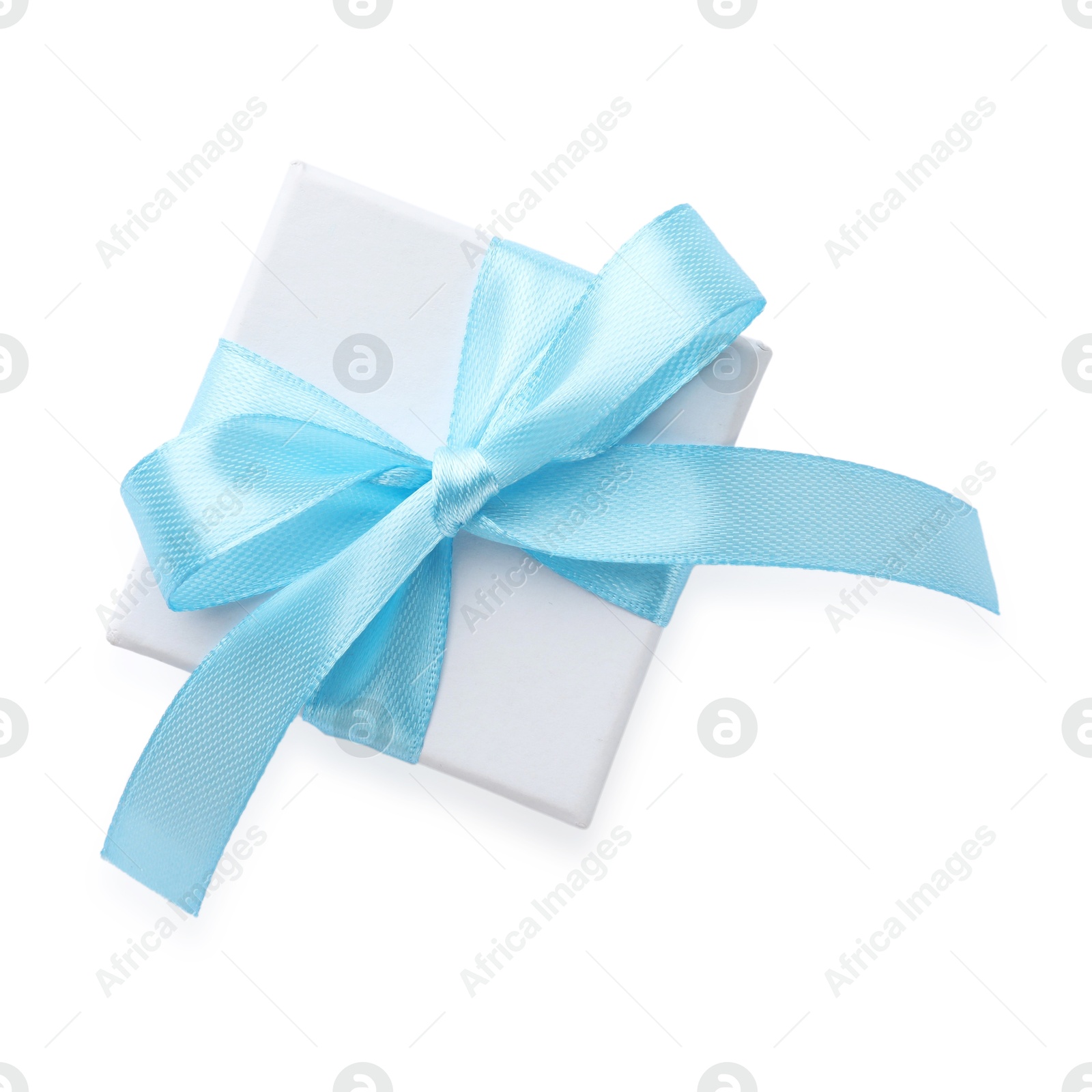 Photo of Beautiful gift box with light blue bow isolated on white, top view