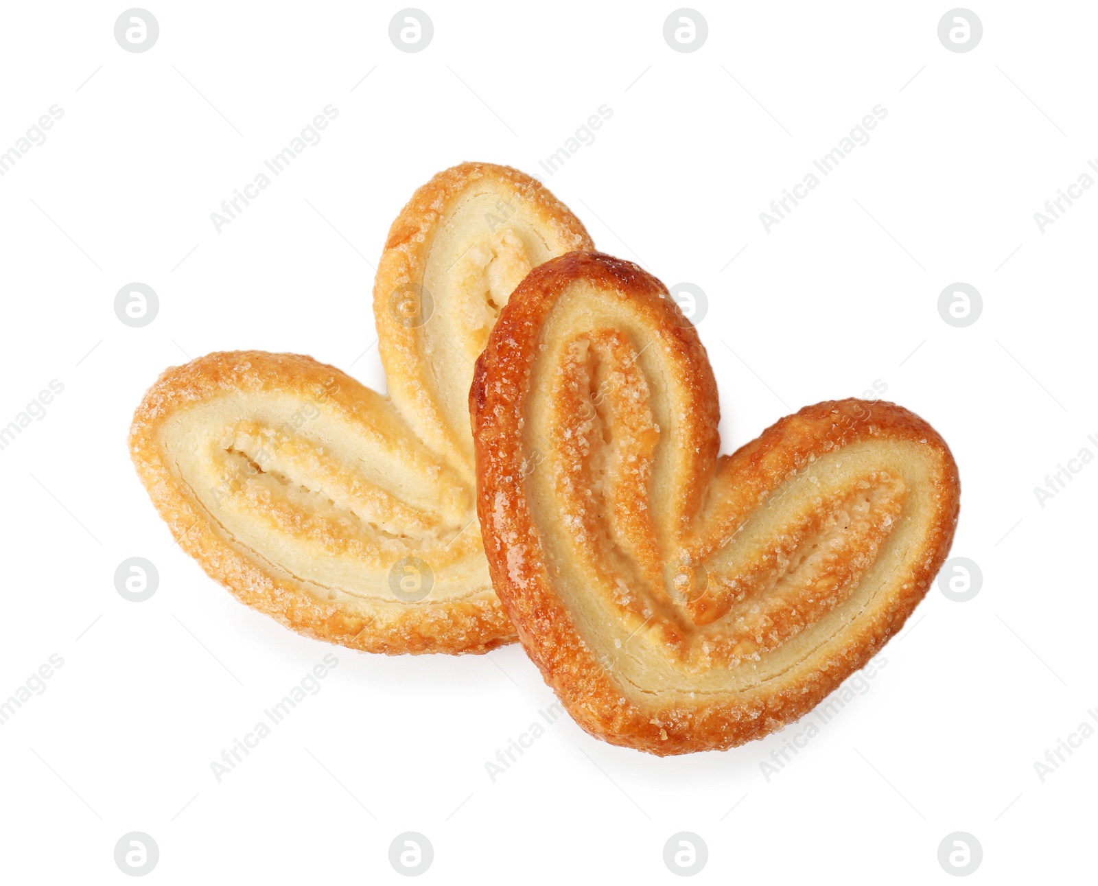 Photo of Tasty french palmier cookies isolated on white, top view