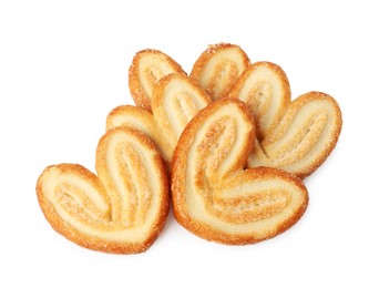 Photo of Tasty french palmier cookies isolated on white, top view