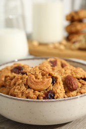 Photo of Delicious oatmeal cookies with raisins and nuts on table, closeup