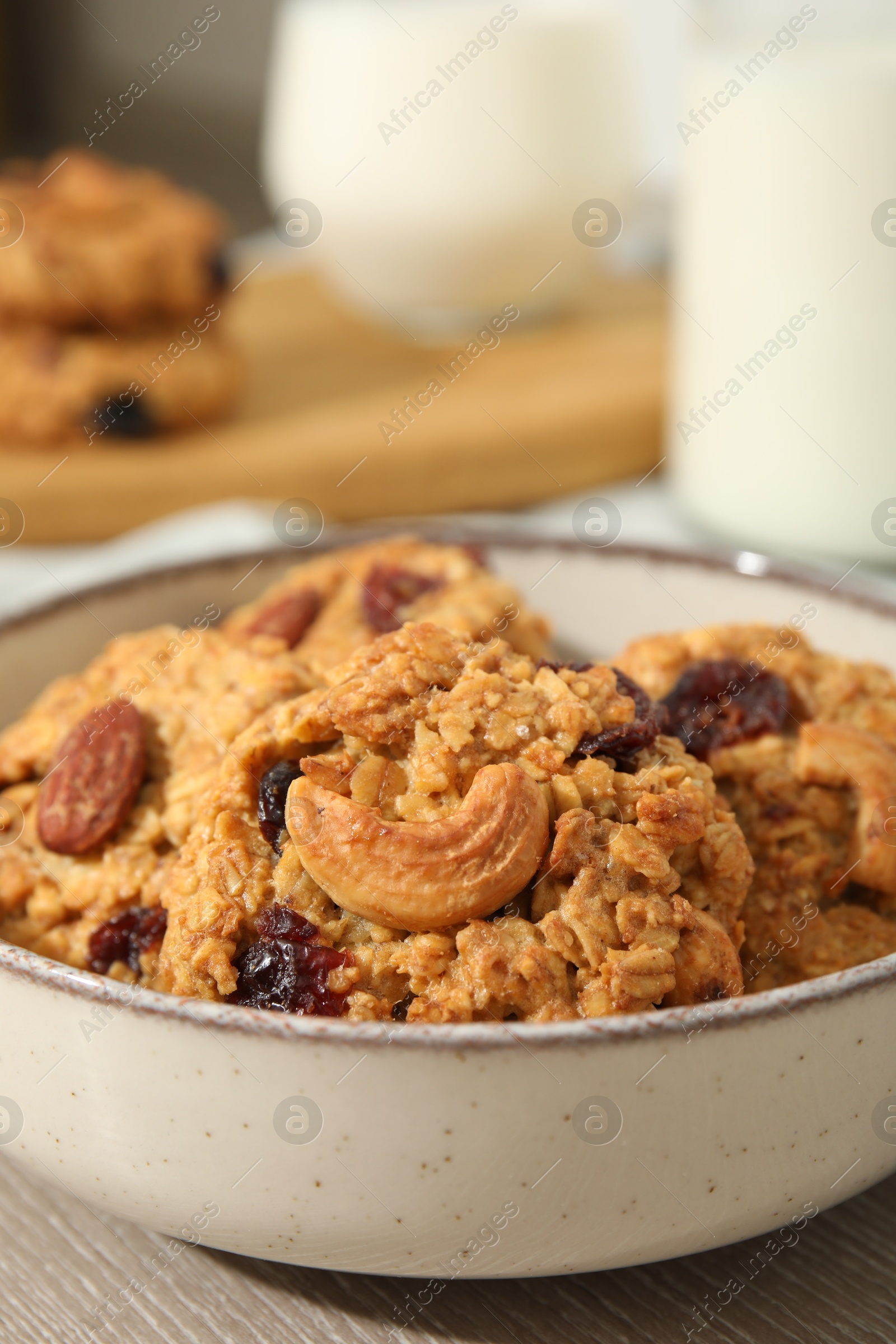 Photo of Delicious oatmeal cookies with raisins and nuts on table, closeup