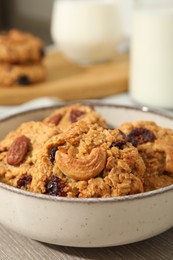 Photo of Delicious oatmeal cookies with raisins and nuts on table, closeup