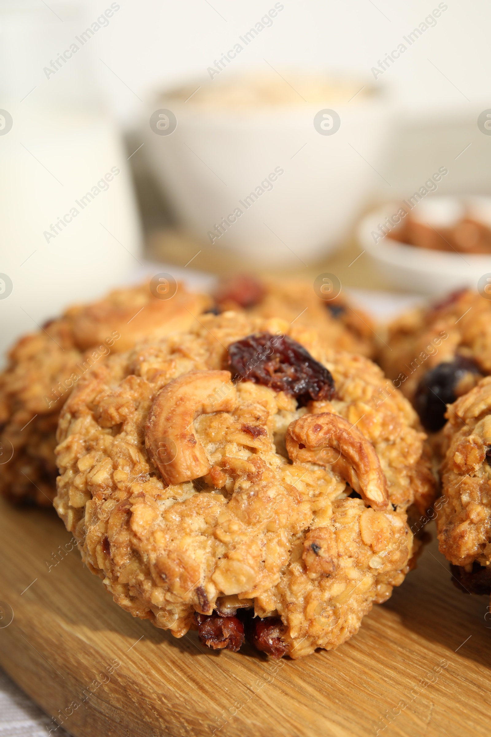 Photo of Delicious oatmeal cookies with raisins and nuts on table, closeup